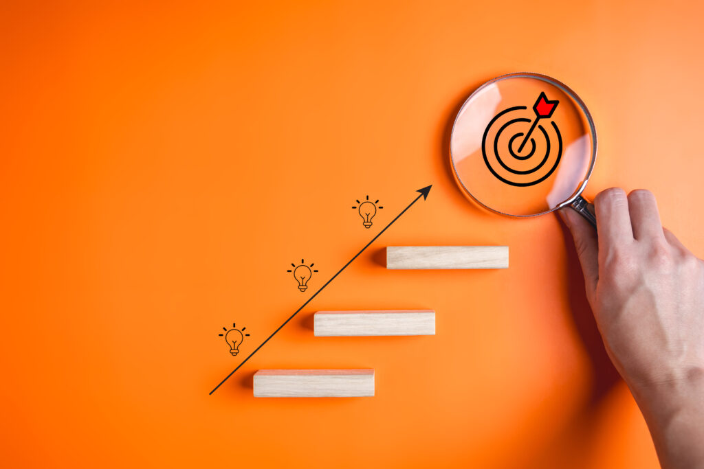 Target and light bulb icons on wooden blocks, Business growth success process, Business achievement goal and target, Planning and development for corporation